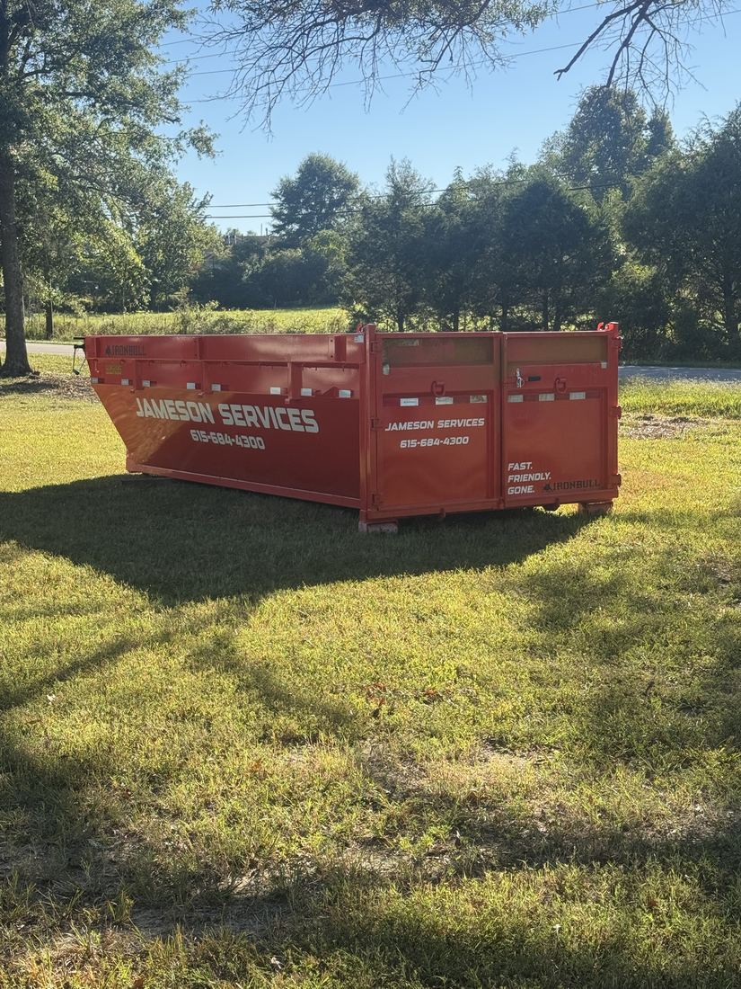 Jameson Services branded dumpster trailer parked in a yard in Smithville, TN